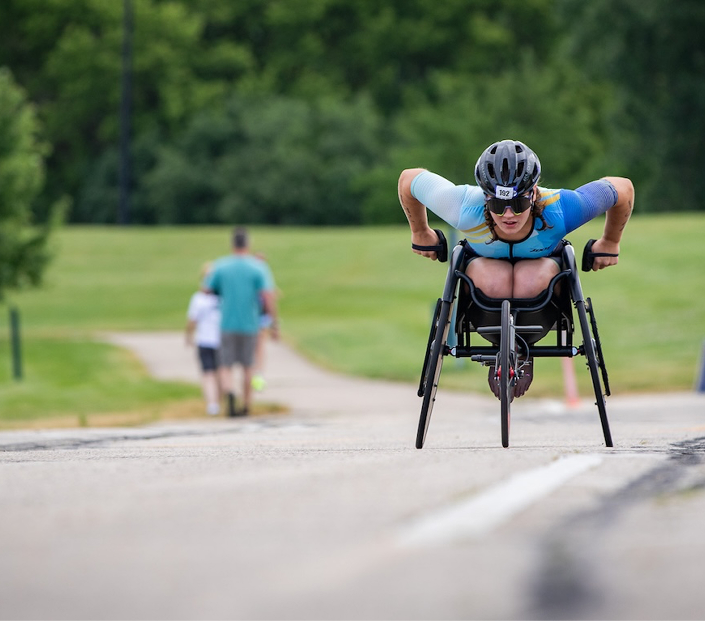 Dare2tri atlete in wheelchair competing in a race.